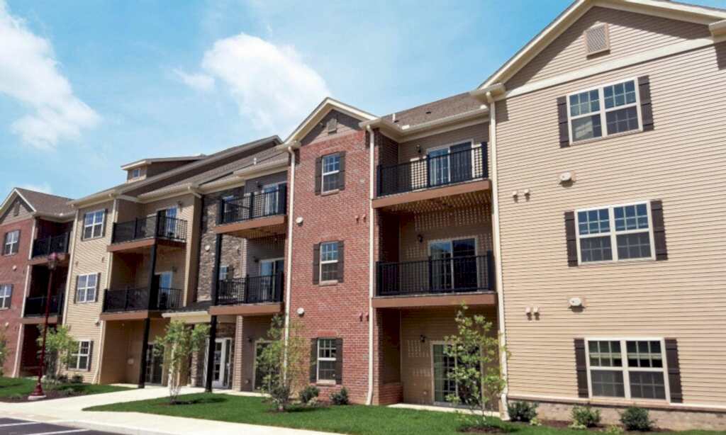 A group of apartment buildings with balconies and windows.